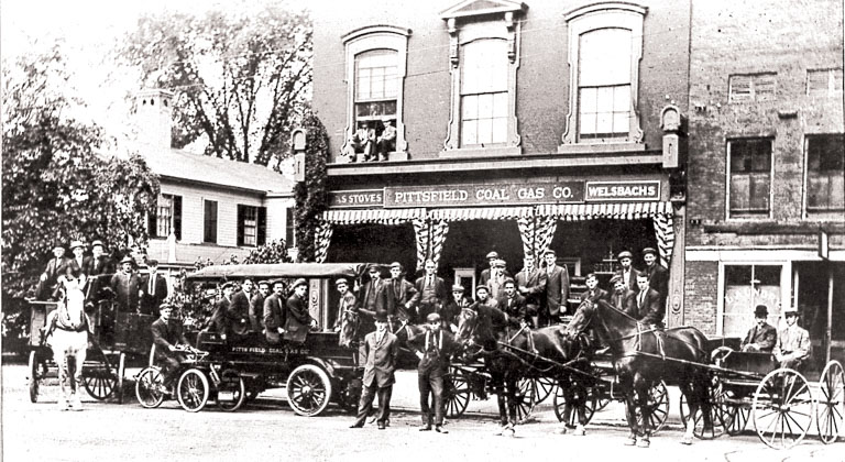 Photo of horse-drawn carts in front of the Pittsfield Coal Gas Co.